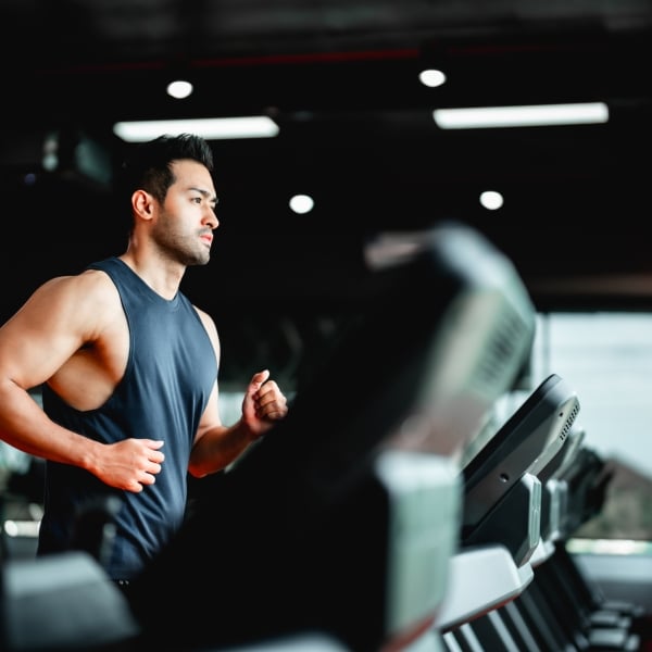 A man runs on a treadmill