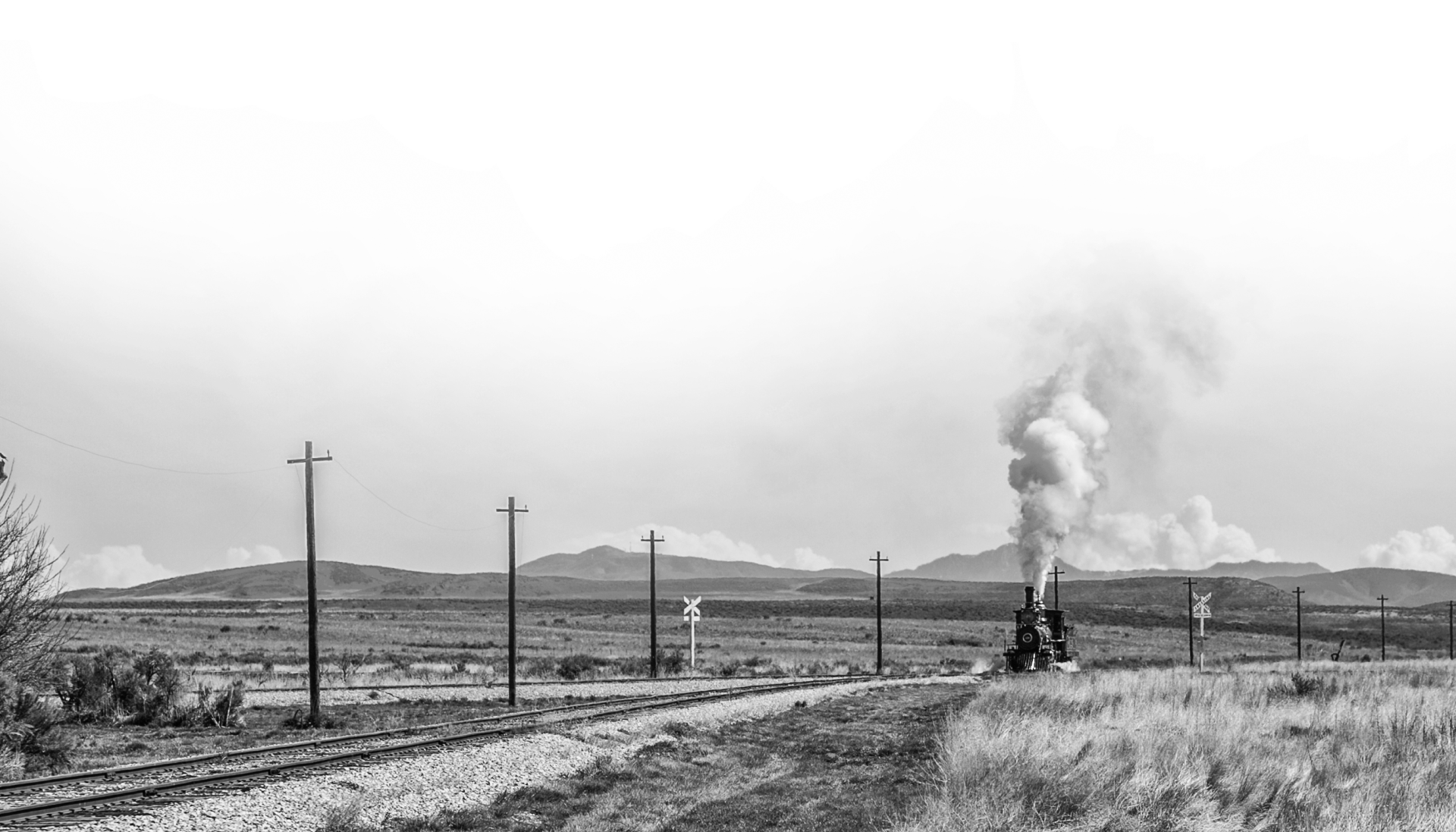 A train coming down the tracks in a historical image