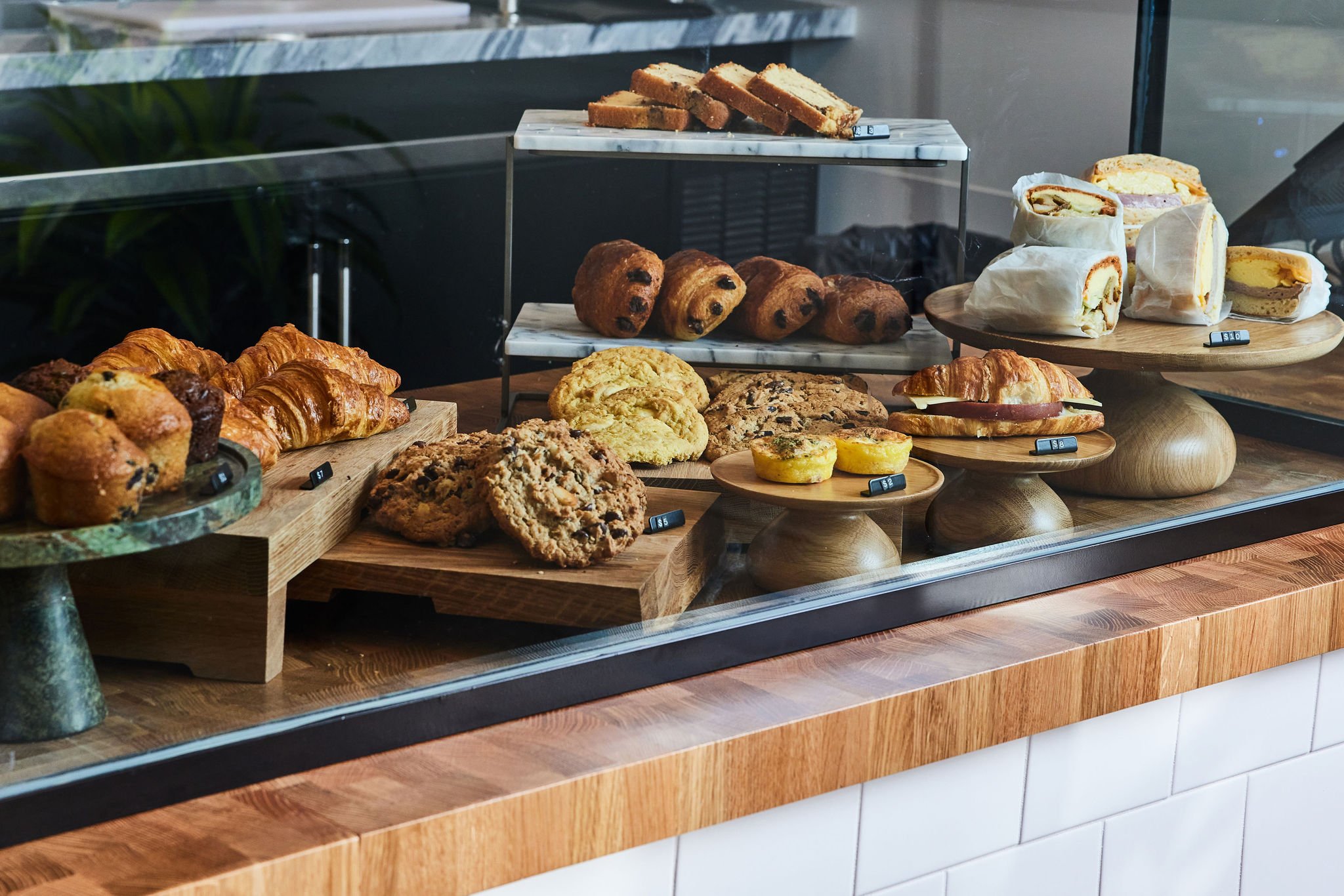 A display case of cookies, croissants, premade sandwiches and egg bites at Counterpart at Asher Adams Hotel, Salt Lake City