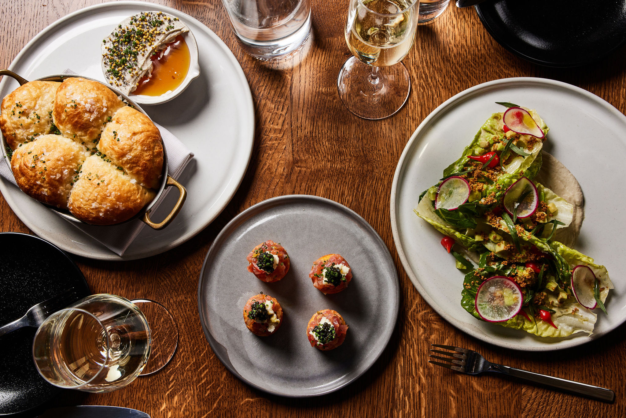 A spread of dishes served at Rouser, restaurant at Asher Adams Hotel, Salt Lake City