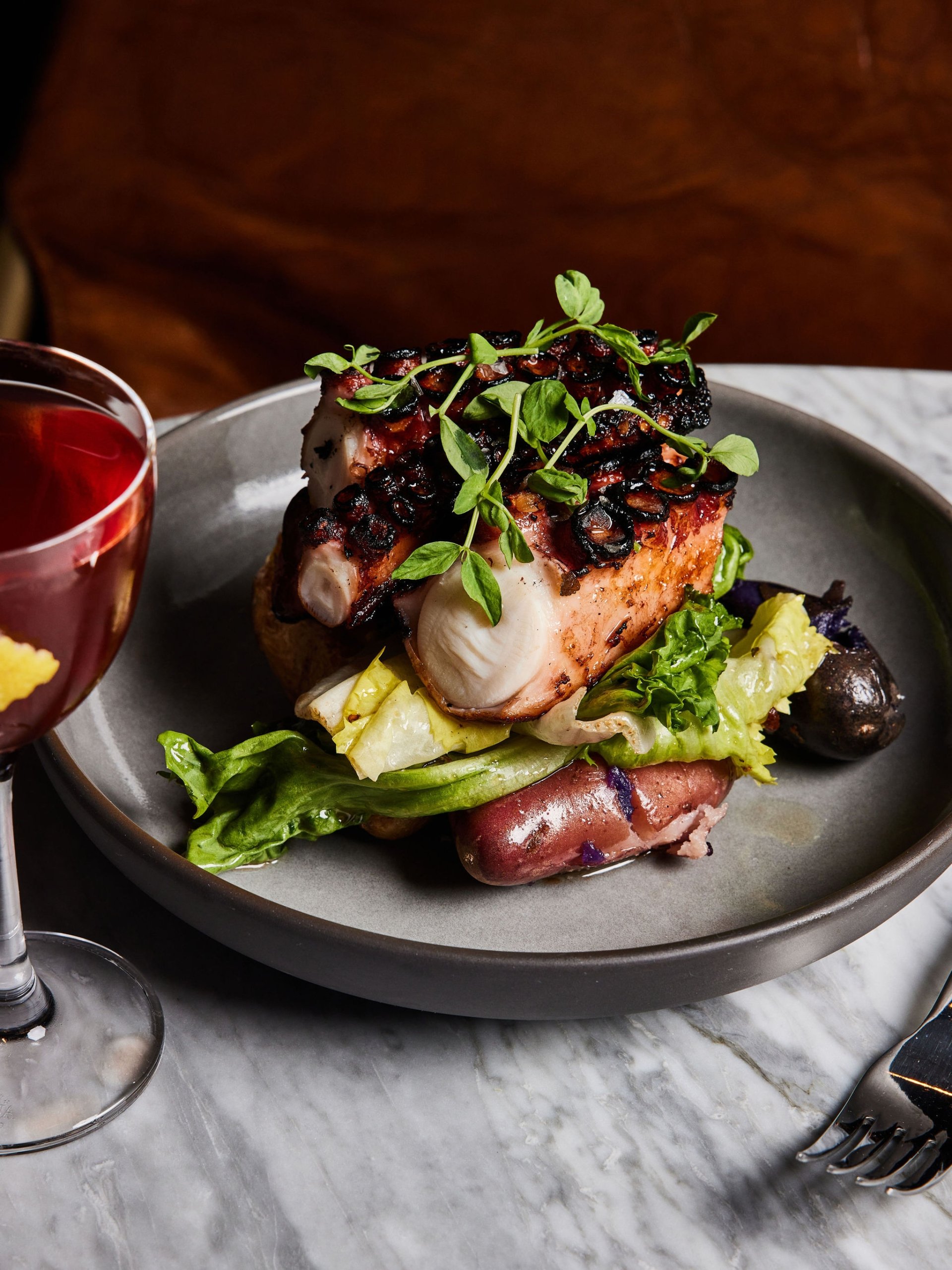 A meat and salad dish served at Rouser, restaurant at Asher Adams Hotel, Salt Lake City