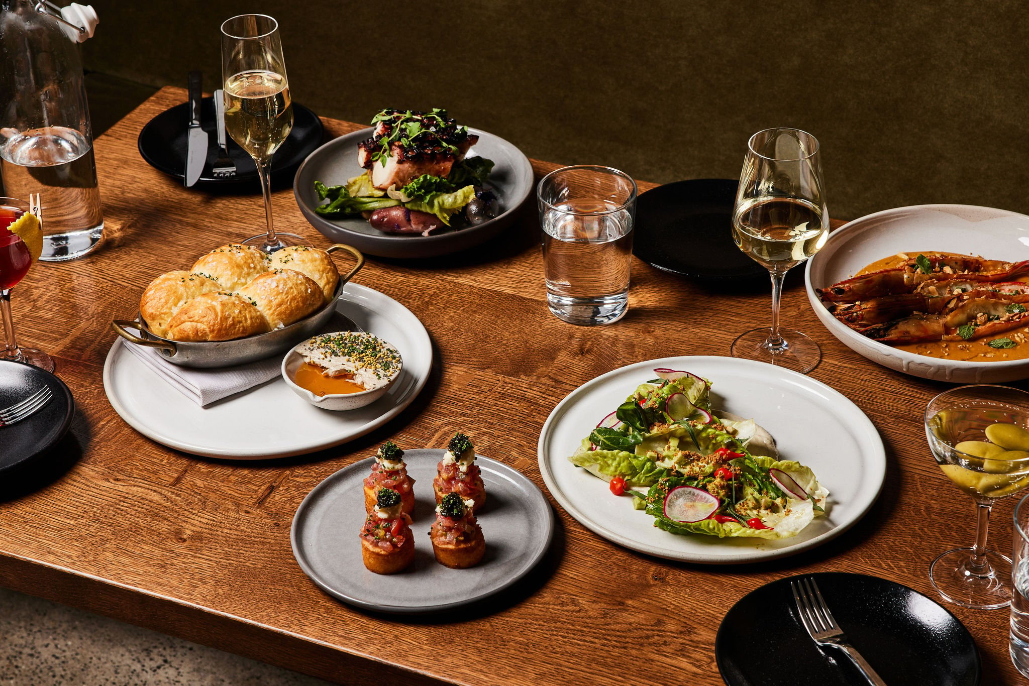 A spread of dishes served at Rouser, restaurant at Asher Adams Hotel, Salt Lake City