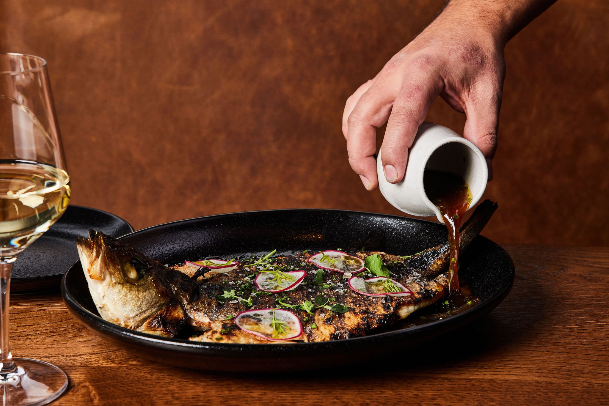 A baked whole fish dish served at Rouser, restaurant at Asher Adams Hotel, Salt Lake City