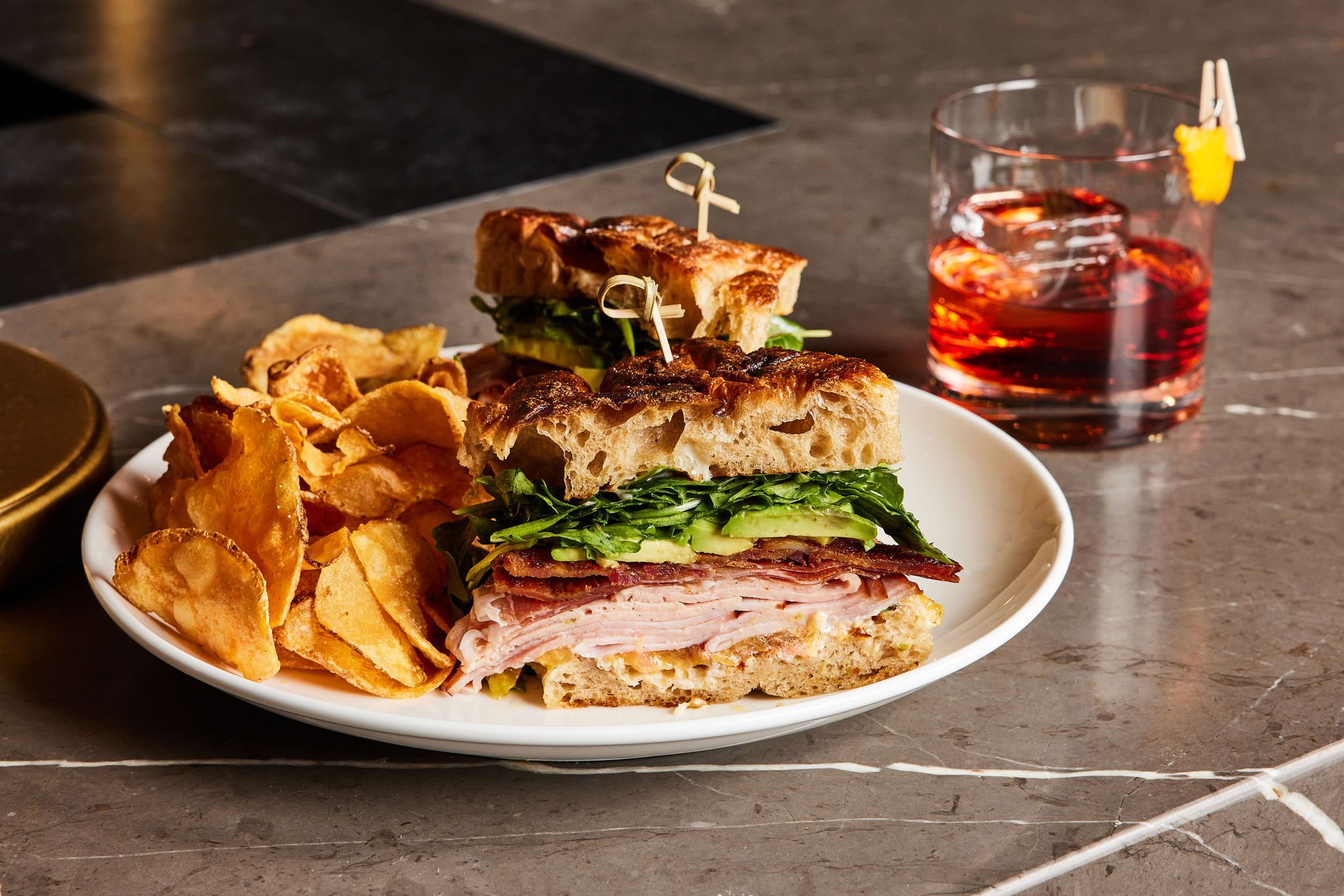 A sandwich and chips at The Bar at Asher Adams, Salt Lake City