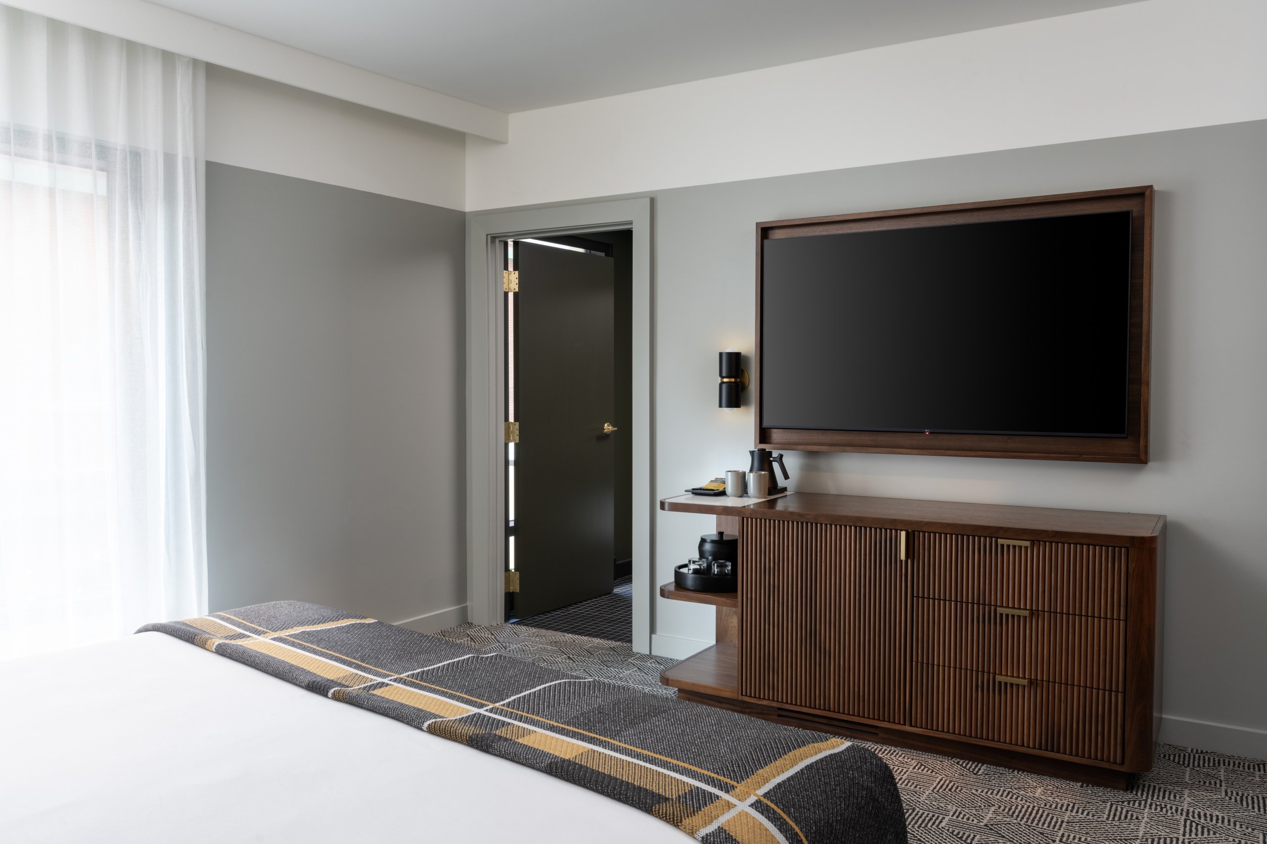 A king bed and HDTV at Asher Adams Hotel, Salt Lake City