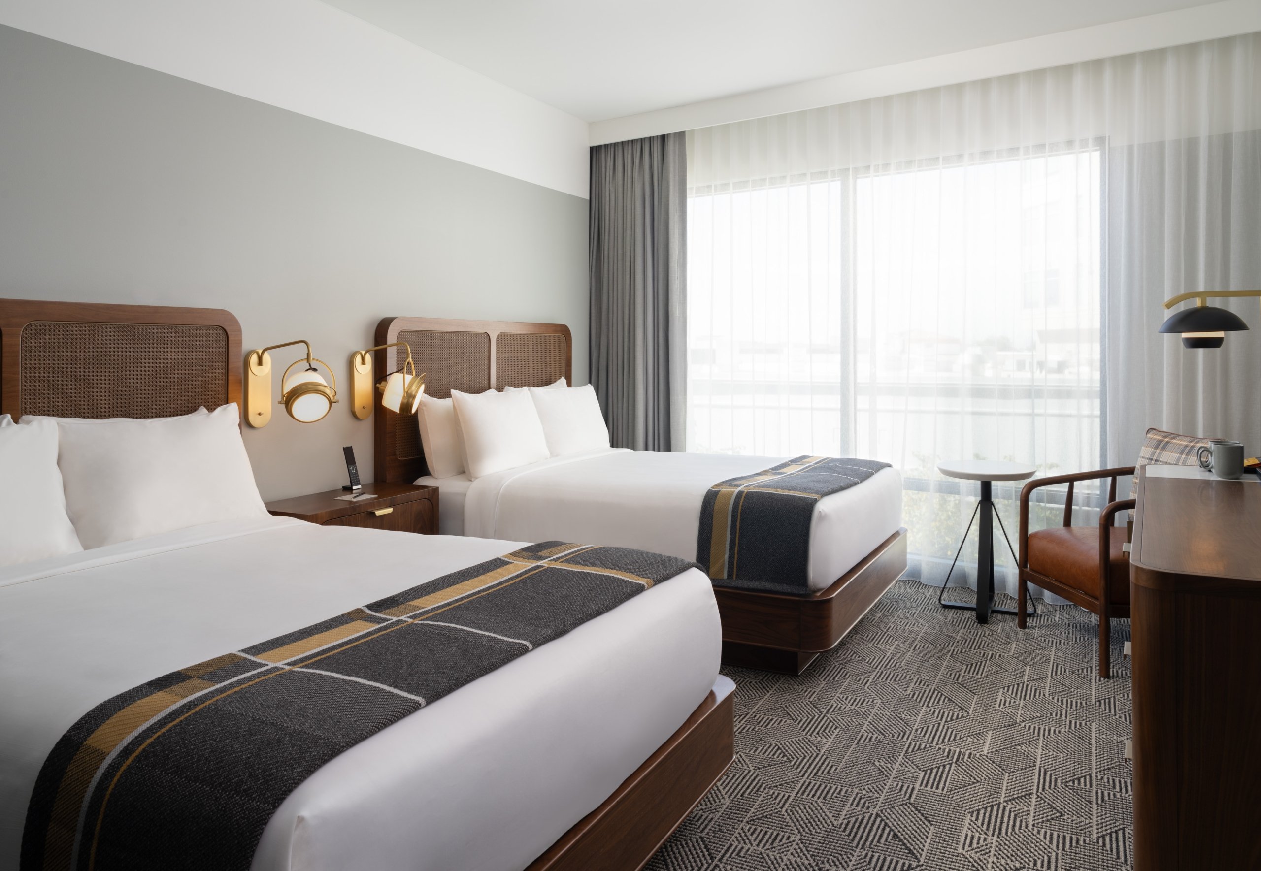 The interior of a two queen bed suite at Asher Adams Hotel in Salt Lake City