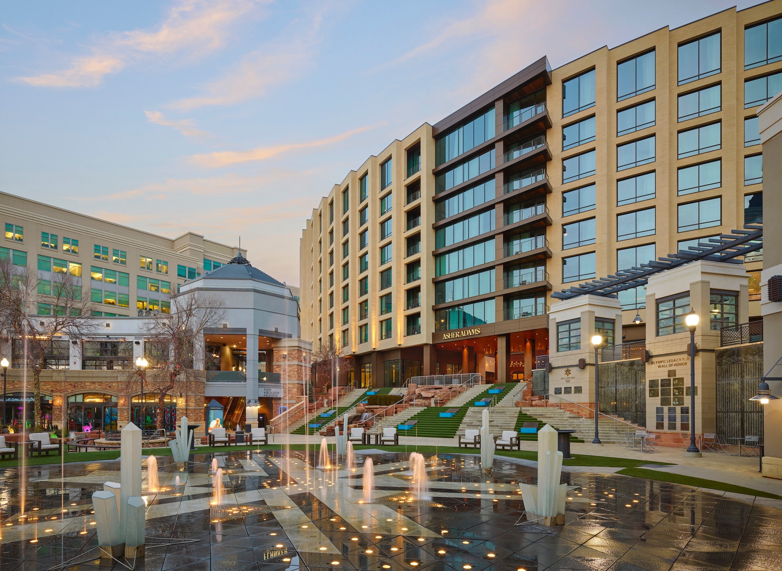 The exterior of Asher Adams Hotel, Salt Lake City, featuring a welcoming courtyard with fountains.