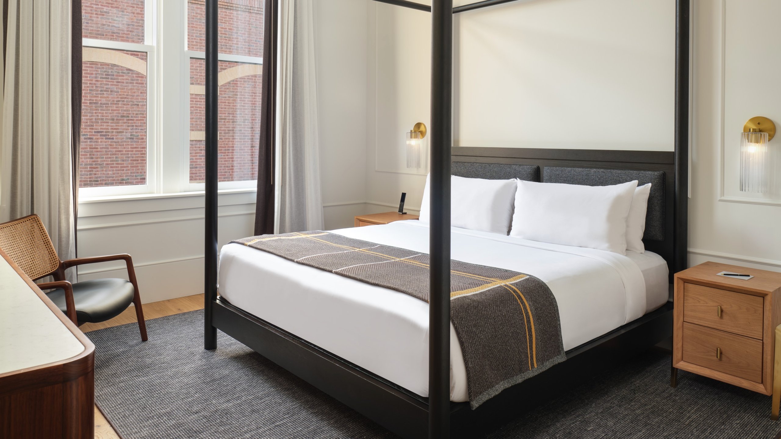 The interior of the Historic King with king bed at Asher Adams Hotel.