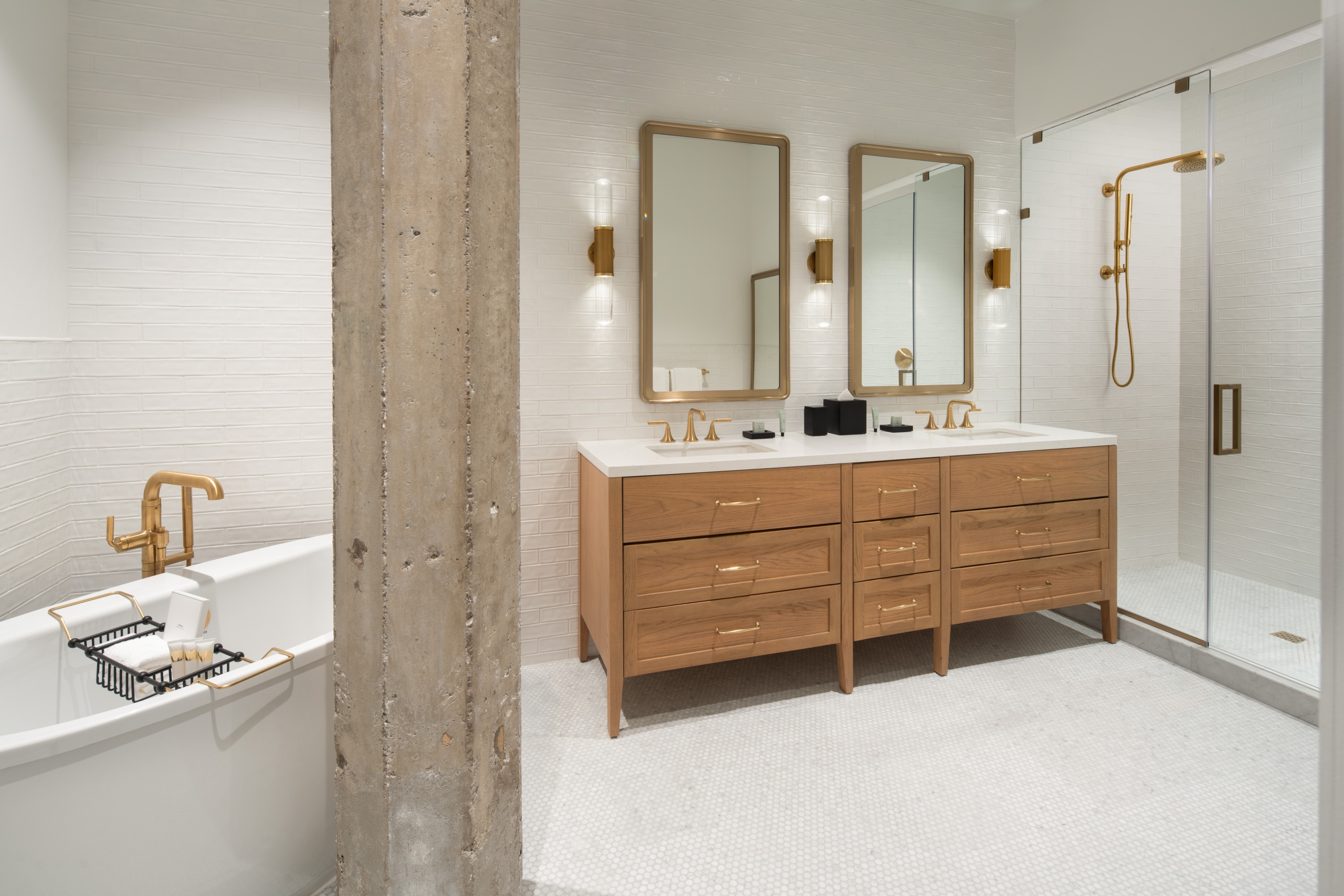 A bathroom with two-person vanity and large soaking tub in a suite at Asher Adams Hotel, Salt Lake City