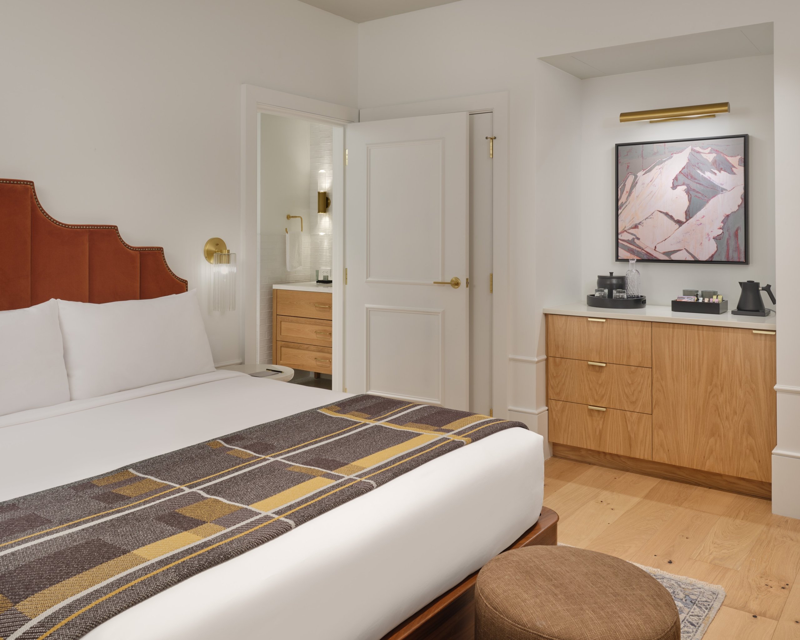 The bed and bathroom area of a suite at Asher Adams Hotel, Salt Lake City