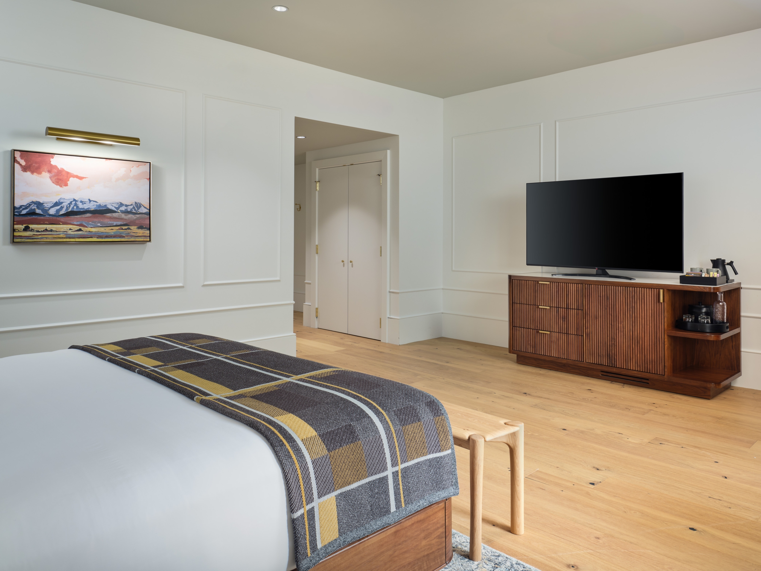 The bed and tv in a suite at Asher Adams Hotel, Salt Lake City