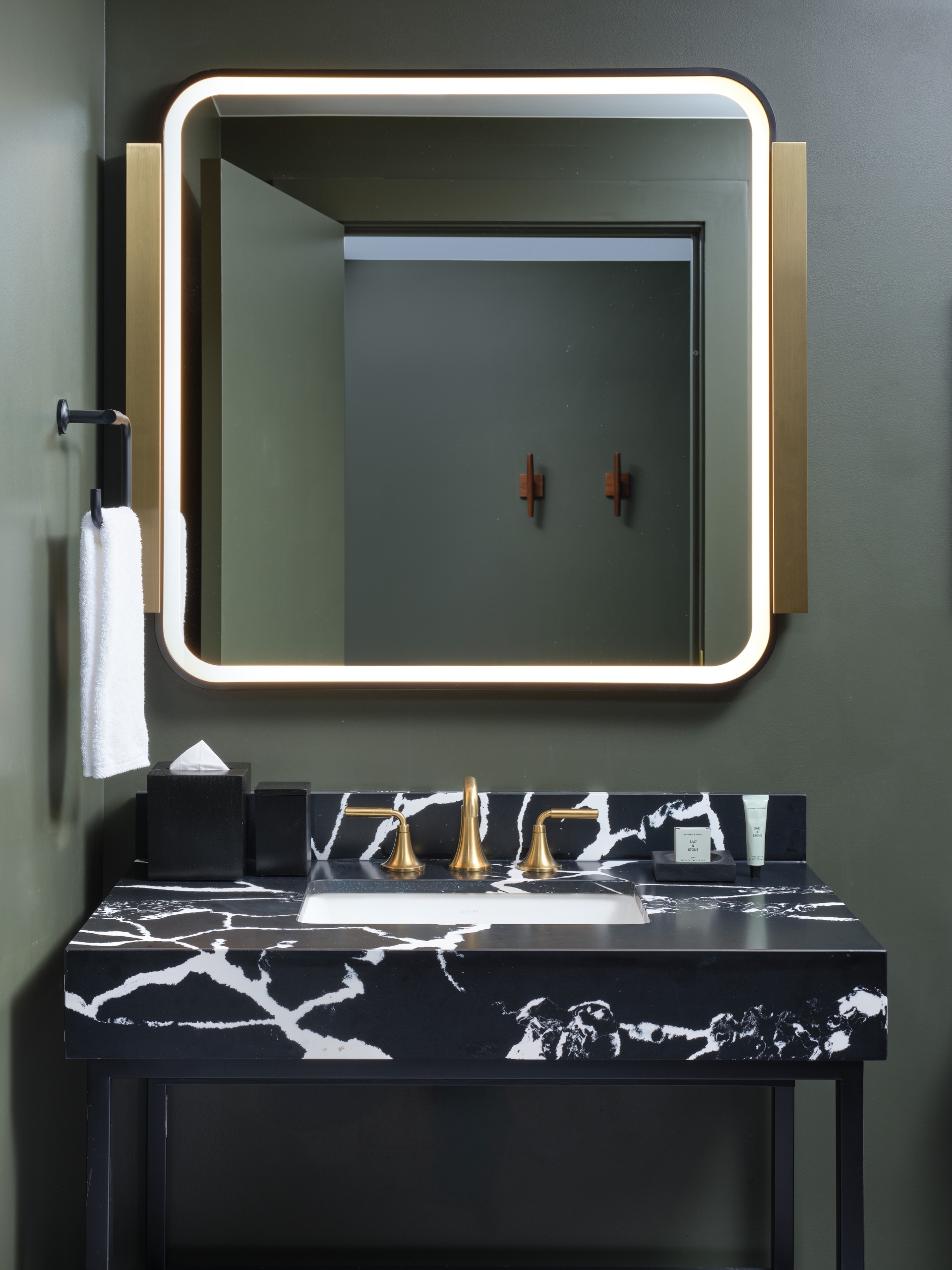 The half bath vanity in the Adams Penthouse Suite at Asher Adams Hotel