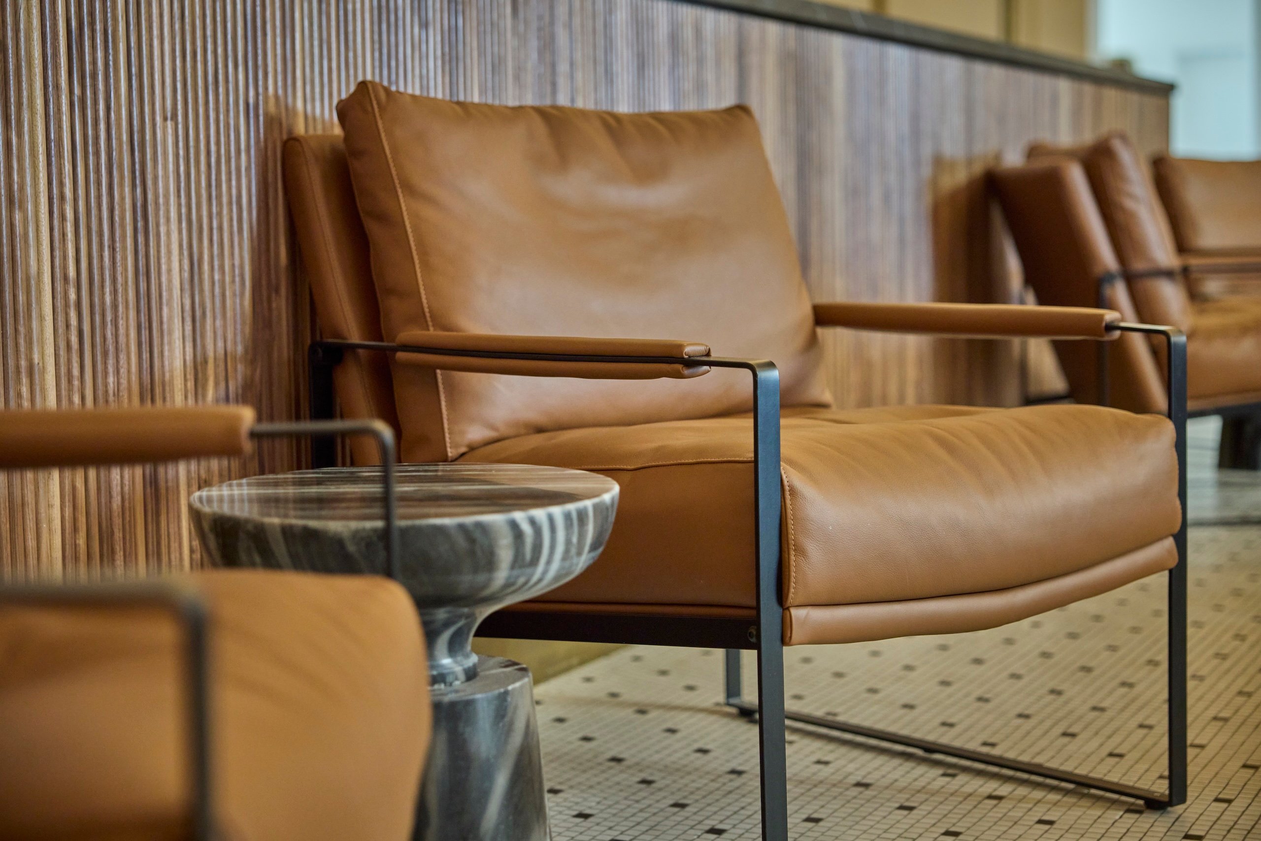 Brown leather chairs in a sitting area at Asher Adams Hotel, Salt Lake City