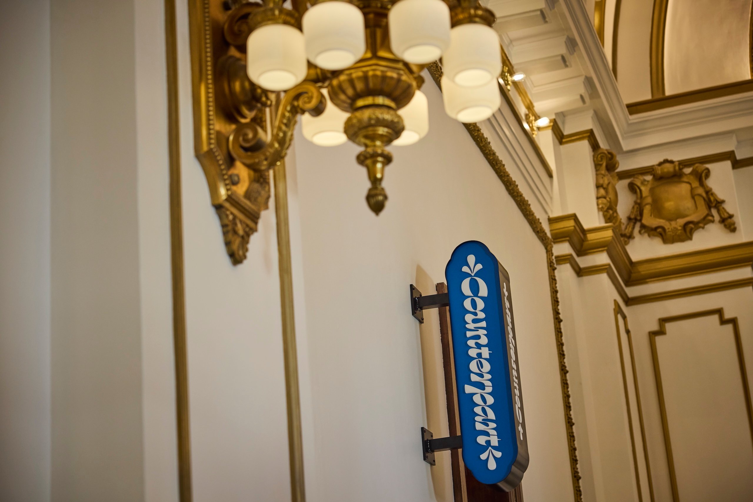 A wall-mounted Counterpart sign at Asher Adams Hotel, Salt Lake City